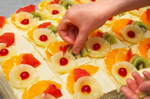 decorating the custard filled cakes with fruits
