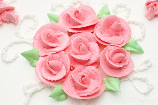 creamy cake decorated with roses. suitable as background.