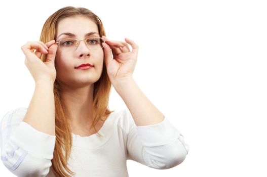 Girl in white looking through glasses, holding it by her hands