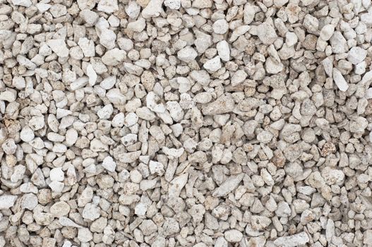 small crushed stones (road metal) material. textured background.