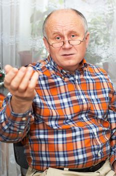 Casual bald senior man emotional portrait series.