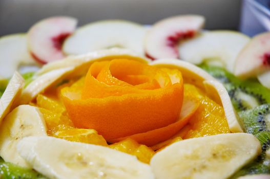 Perfectly designed fresh juicy fruit salad on plate.
Close-up series. Shallow DOF.