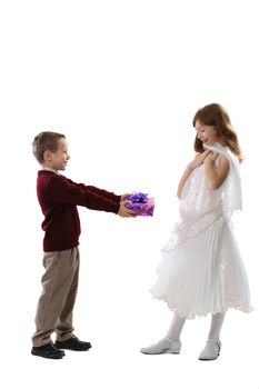 The boy gives a gift to the favourite girl