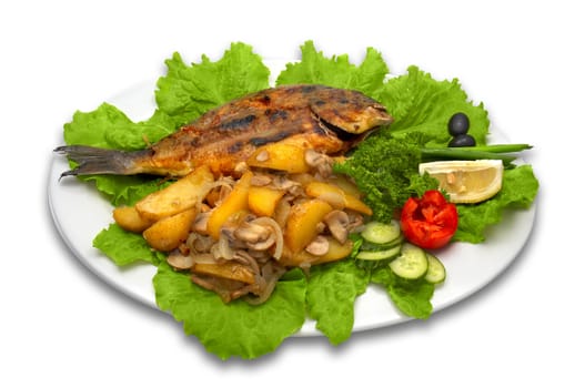 whole griled dorada fish, with baked potato, mushrooms and fresh vegetables, served on plate with lettuce leaves with lemon slice.