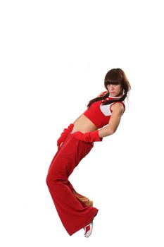 The beautiful girl dances in a red suit 