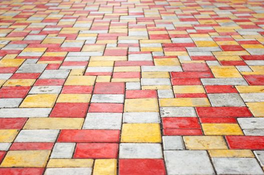 orange, gray and yellow colored paving slab perspective background