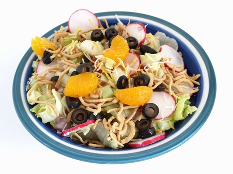 Crisp salad of lettuce, radishes, olives, mandarin oranges, cheese and Chinese noodles. Studio isolated over white.