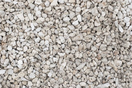small crushed stones (road metal) material. textured background.