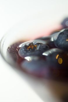 macro shot of blueberries under spirit