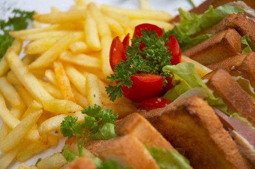 tasty juicy club sandwich with french fries