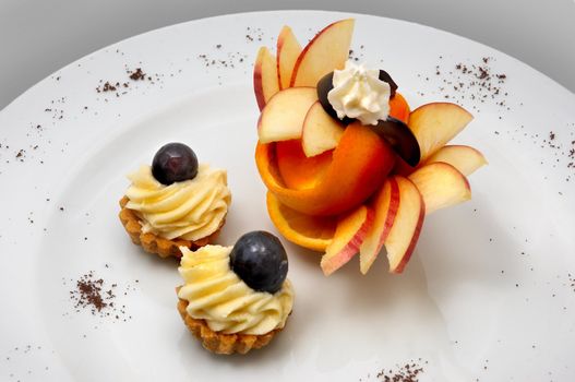 petit four served on plate with original fruit design