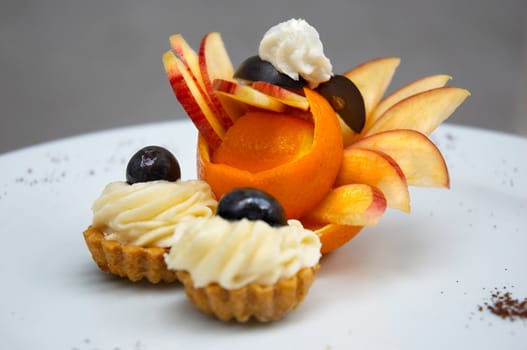 petit four served on plate with original fruit design