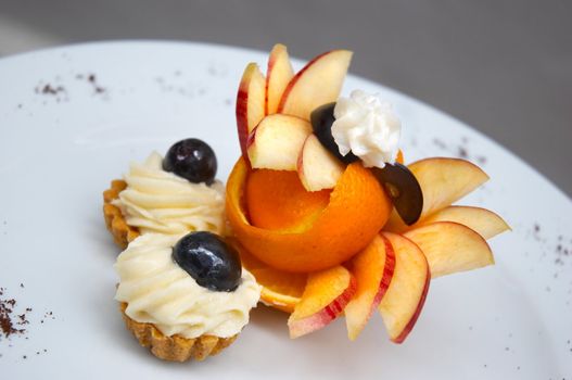 petit four served on plate with original fruit design