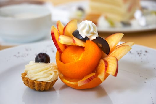 petit four served on plate with original fruit design