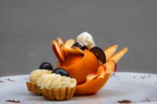 petit four served on plate with original fruit design