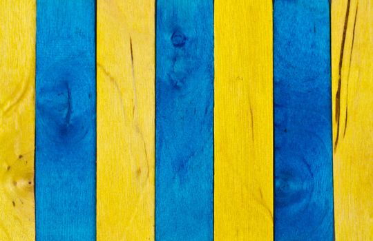 Vertical arrangement of blue and yellow wood in landscape orientation