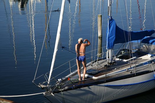 Early morning shower on deck of a saling boat.