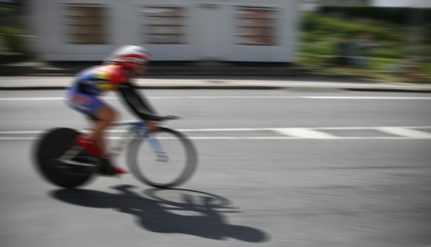 Young racing cyclist during the individual time trial to the Danish Championship 2011 in Nyborg Denmark. Intentional  motion blur.