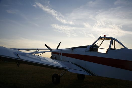 Piper Pawnee PA-25 used for pulling up gliders in low evening sun - Arnborg, Denmark.