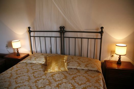 Iron bed - Italian hotel room.  Natural lightening.