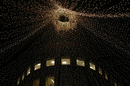 Urban christmas illumination - office building in background.