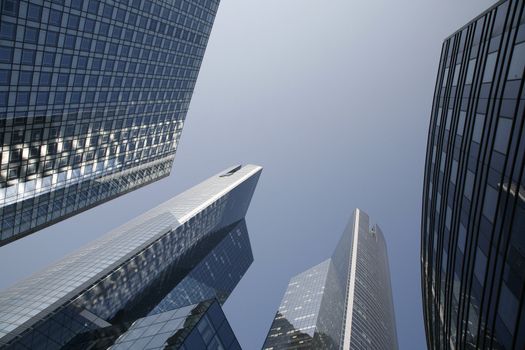 Futuristic corporate office buildings - La Defense, Paris. Space for text.