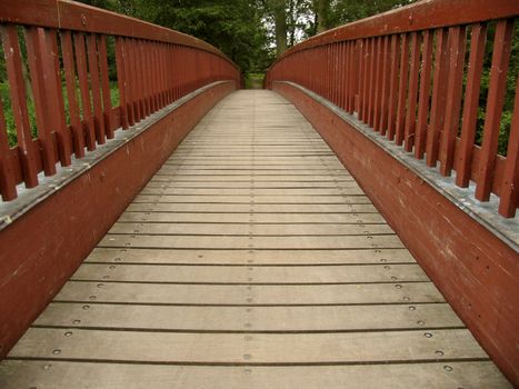 Wooden gangway crossing a river.