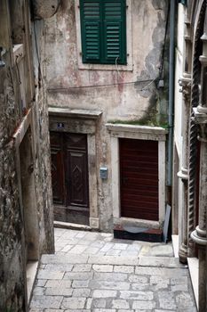 Narrow and old street in Sibenik city, Croatia, medieval zone