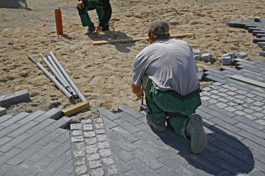 Pavers on job. Constructing a difficult pattern.