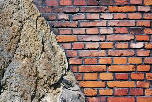 Background of old brick wall built on rock