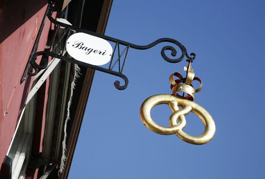 Golden pretzel outside a baker shop witch is the traditional sign of a Danish bakery. No property release needed.