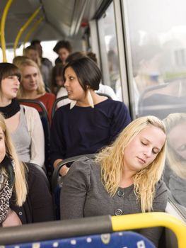 Woman sleeping on the bus