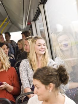 Happy woman on the bus