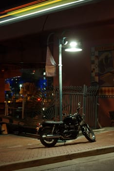 motorcycle under street lamp
