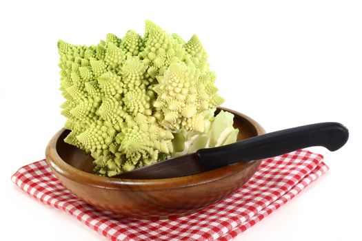 a fresh, raw Romanesco on a white background