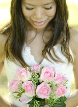 Asian bride at outdoor in a morning