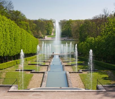 Foutains with water gushing in a nice park in France