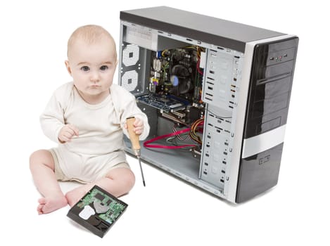 young child with screwdriver in hand working on open computer in white background. hard disk laying around