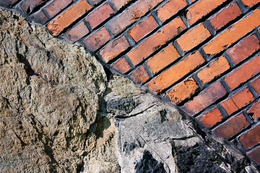 Background of old brick wall built on rock