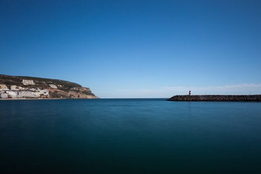 Lighthouse in port. Sesimbra, Portugal.