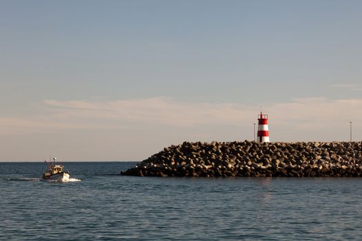 fishing boat arriving at the port of Sesimbra.