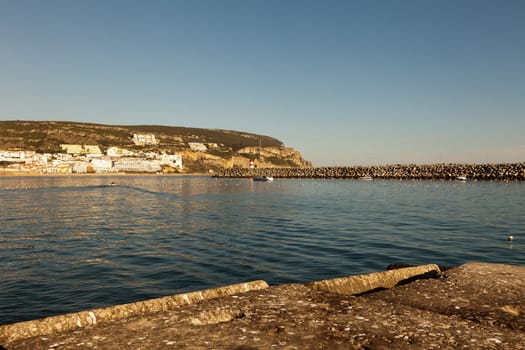 Lighthouse in port. Sesimbra, Portugal.