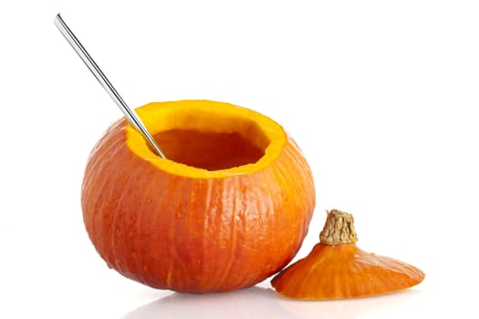 Pumpkin, with top remove and seeds cleand out, isolated on a white background.