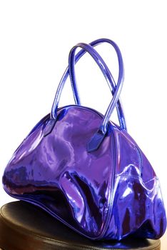 fashionable purple blue metallic color bag over white