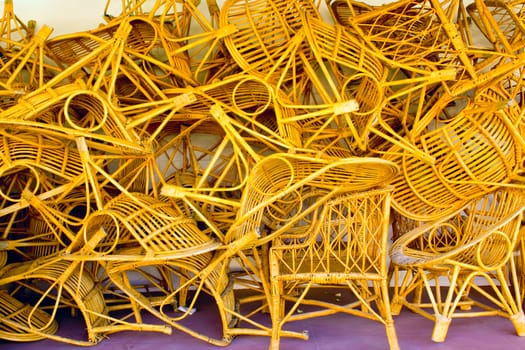 wicker chairs piled in a heap