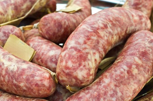 Traditional Italian sausages on display at farmer's market