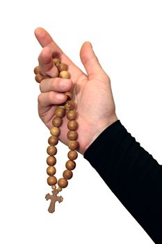 Wooden rosary with a cross hanging on his arm