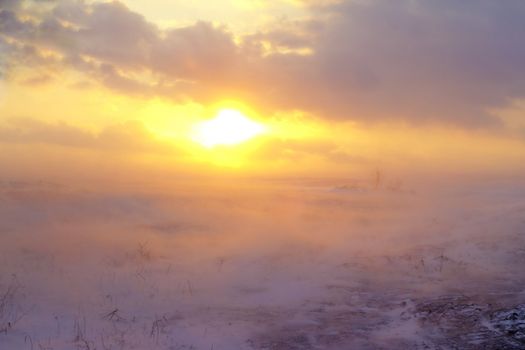 snow storm in the desert at sunset