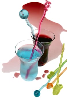 Red wine spill and a blue spirit in small glass
