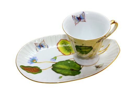 porcelain coffee cup with a saucer under the oblong dessert